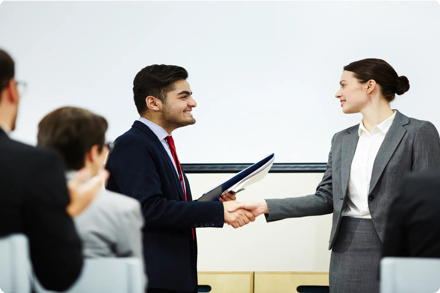 MoU partnership handshake between a college and Icanio Tech School