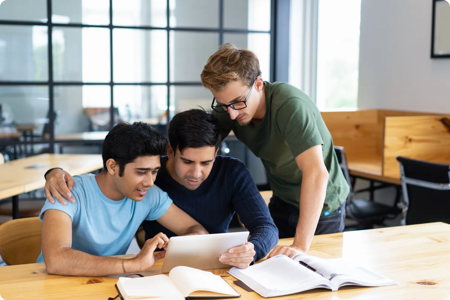Students learning together on a laptop in a value added course
